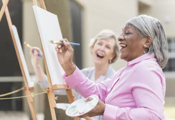 women painting on canvas