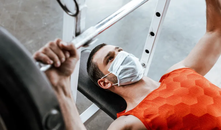 man working out with mask