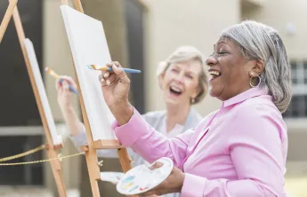 women painting on canvas